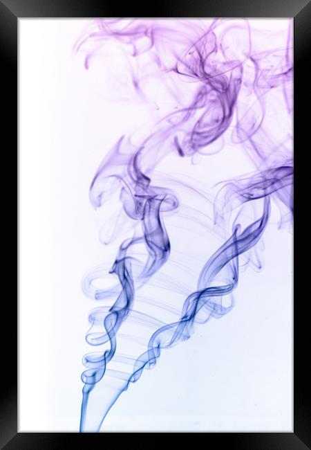 Artistic image of smoke with colour on a white bac Framed Print by Dave Collins