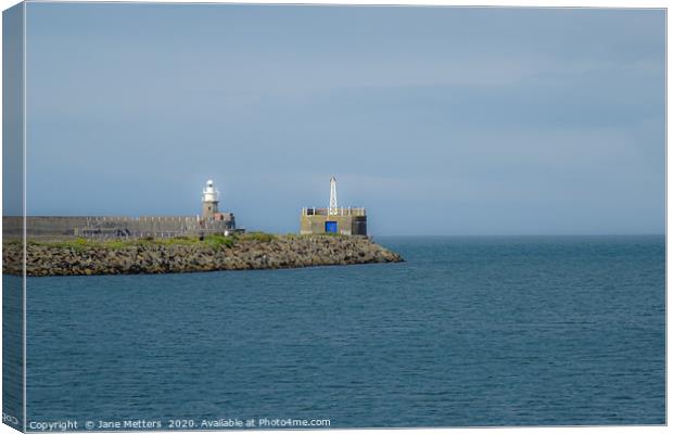 Breakwater Beacon and Lighthouse Canvas Print by Jane Metters