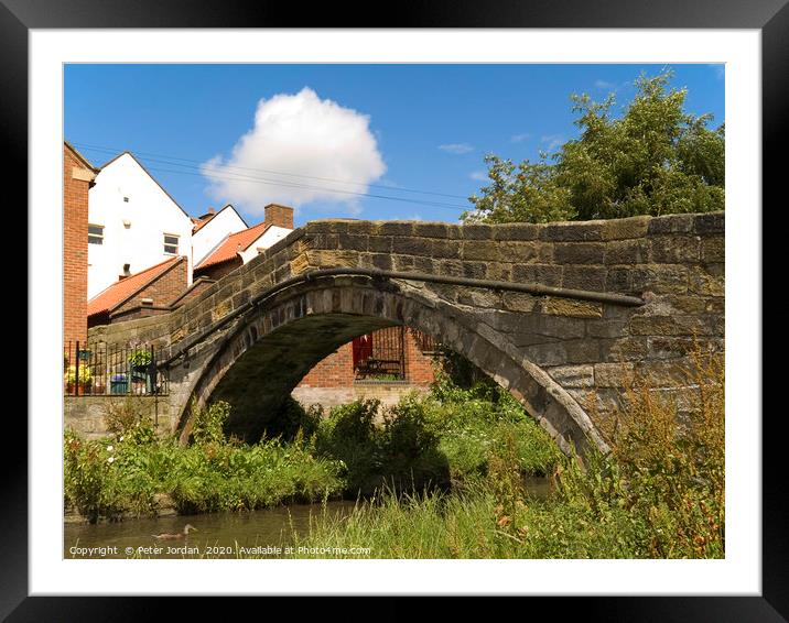 An old pack horse bridge joining the High Street t Framed Mounted Print by Peter Jordan