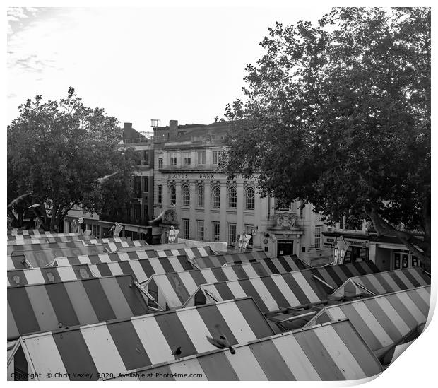 A view across the outdoor market in the city of No Print by Chris Yaxley