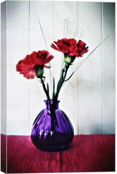 Red Flowers in Purple Vase Canvas Print by Simon Gladwin
