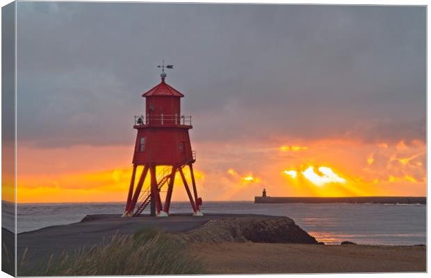 Radiant Sunrise over Red Herd Groyne Lighthouse Canvas Print by Rob Cole
