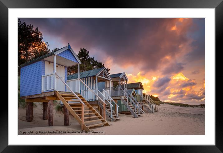 Beach hut sunset at Wells-next-the-sea Norfolk Framed Mounted Print by David Powley