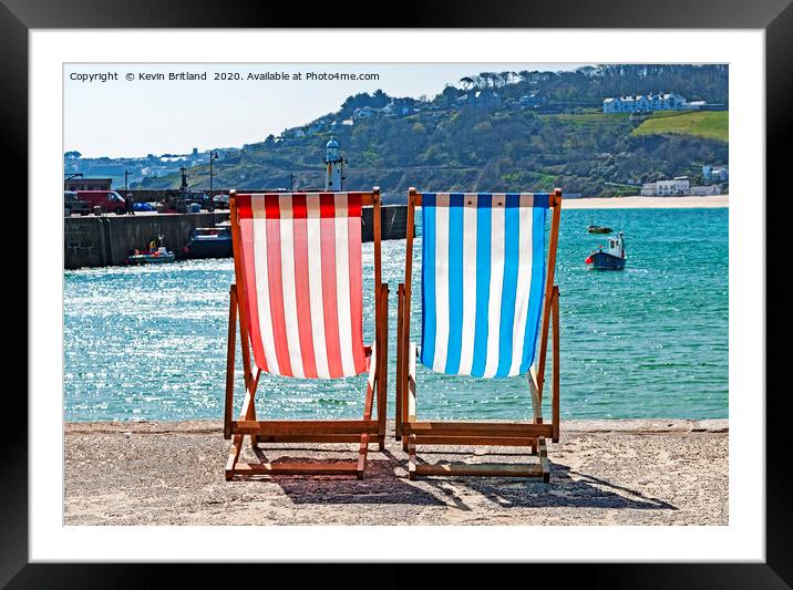empty deckchairs Framed Mounted Print by Kevin Britland