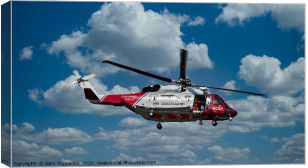 HM Coastguard rescue helicopter. Canvas Print by John Biggadike