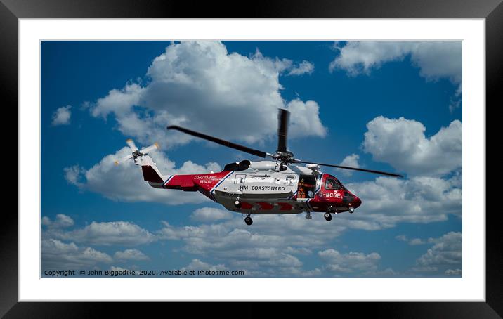 HM Coastguard rescue helicopter. Framed Mounted Print by John Biggadike