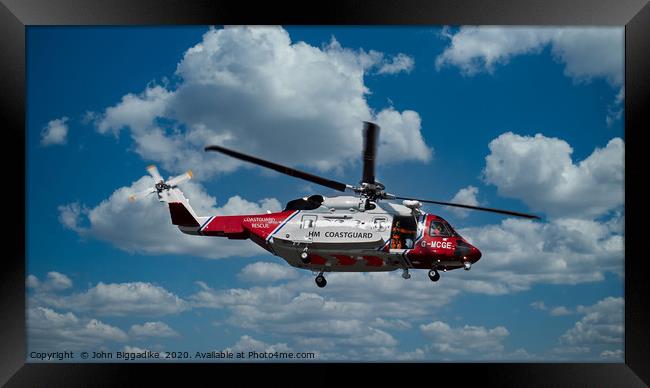 HM Coastguard rescue helicopter. Framed Print by John Biggadike