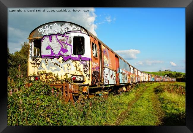Derelict railway carriages covered in graffiti. Framed Print by David Birchall