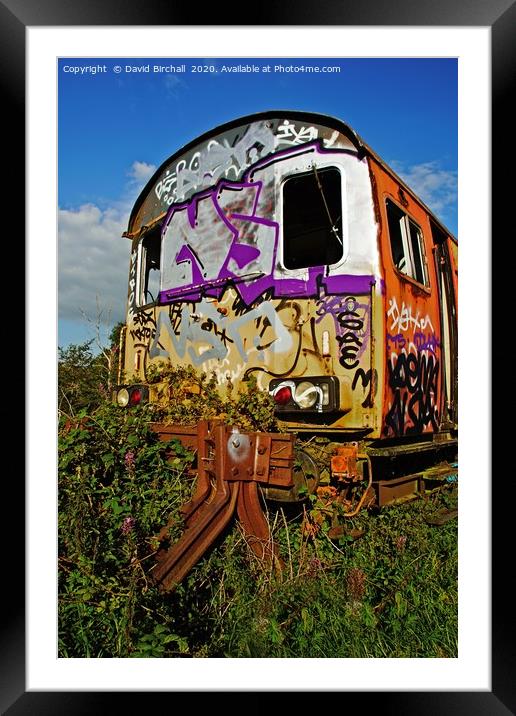 Abandoned railway carriage covered in graffiti. Framed Mounted Print by David Birchall