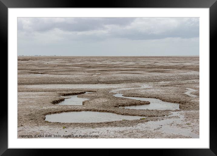 Mud flats seen at Snettisham beach in Norfolk Framed Mounted Print by Clive Wells