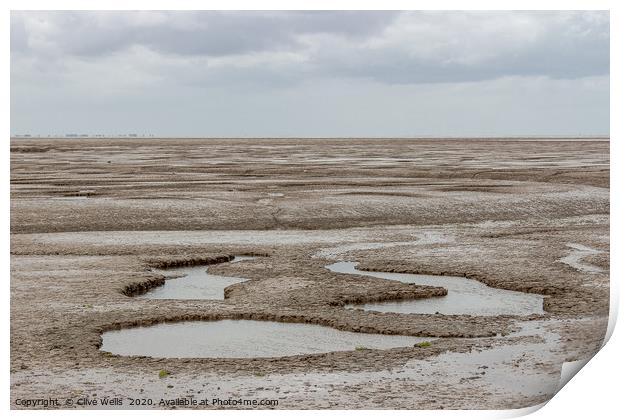 Mud flats seen at Snettisham beach in Norfolk Print by Clive Wells