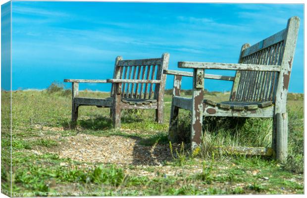 Well worn seats at Snettisham beach in Norfolk Canvas Print by Clive Wells