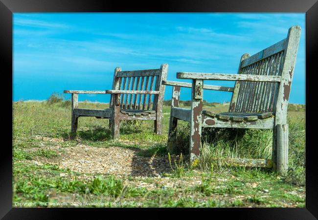 Well worn seats at Snettisham beach in Norfolk Framed Print by Clive Wells