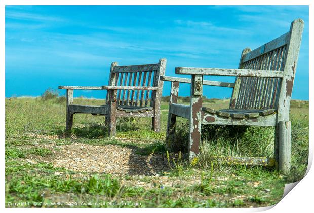 Well worn seats at Snettisham beach in Norfolk Print by Clive Wells