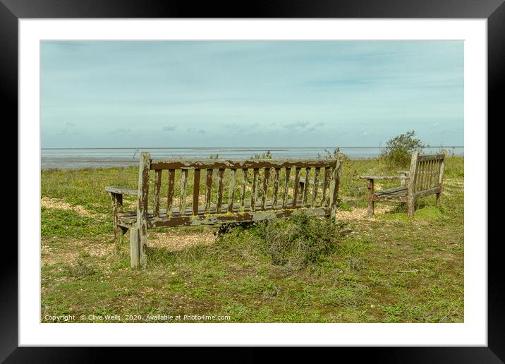 Wooden benches overlooking the Wash at Snettisham Framed Mounted Print by Clive Wells