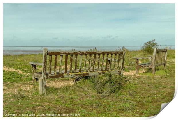 Wooden benches overlooking the Wash at Snettisham Print by Clive Wells