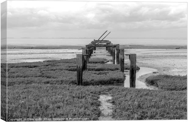 Black & white picture of the old pier at Snettisha Canvas Print by Clive Wells