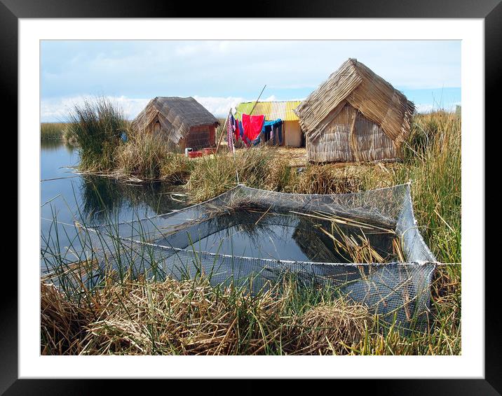 Traditional huts on Uros floating islands Framed Mounted Print by Theo Spanellis