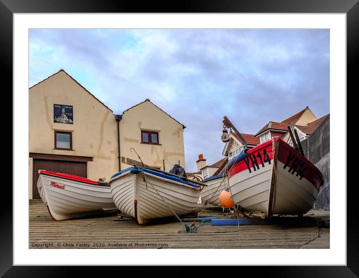 Low down and front on view of fishing boats Framed Mounted Print by Chris Yaxley