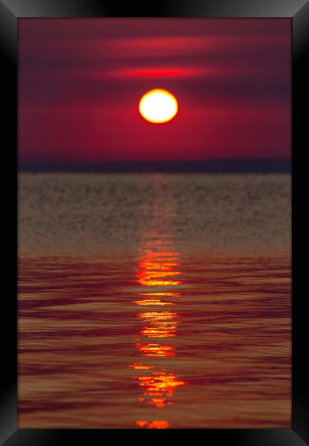 Sunrise light over the lake Framed Print by Arpad Radoczy