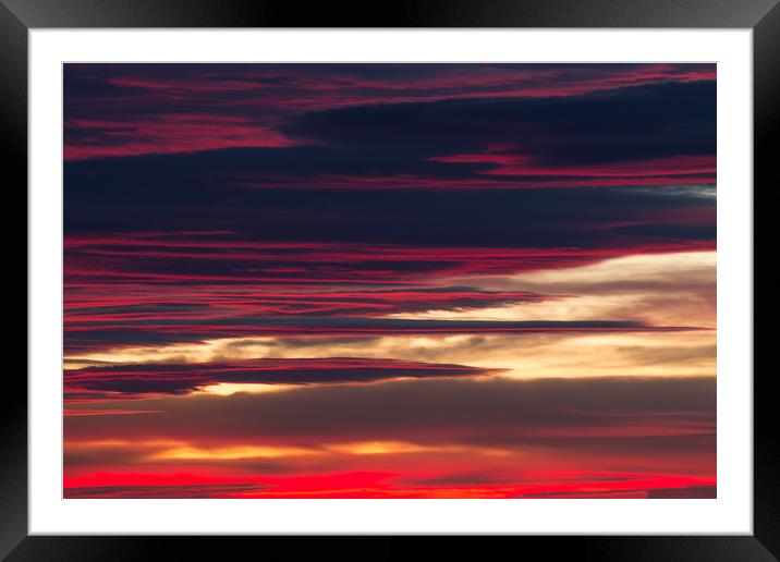 Red clouds in a sunset light Framed Mounted Print by Arpad Radoczy