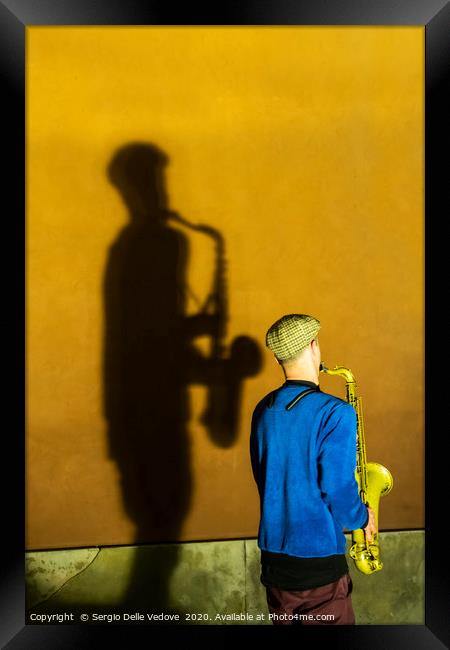 the sax player  Framed Print by Sergio Delle Vedove
