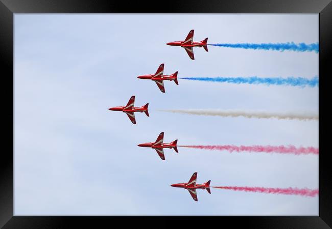 The Red Arrows in formation Framed Print by Simon Marlow