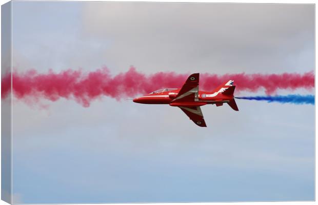 Red Arrows through blue and red smoke Canvas Print by Simon Marlow