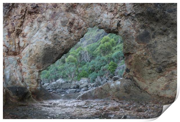 Frame view through a hole in a rock at a coast Print by Hanif Setiawan