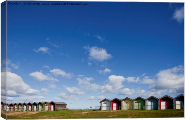 Big Blue Sky and Beautiful Blyth Beach Huts Canvas Print by Jim Jones