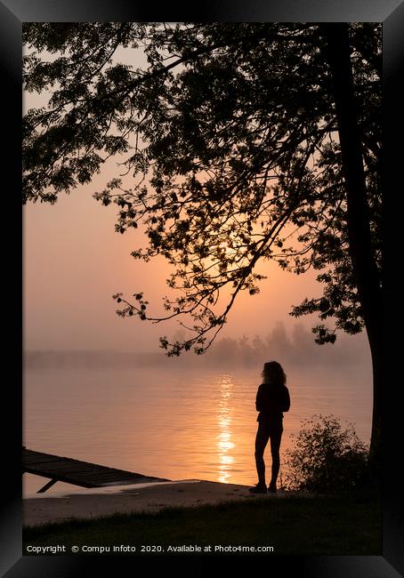silhouette girl at wooden jetty sunrise over the r Framed Print by Chris Willemsen