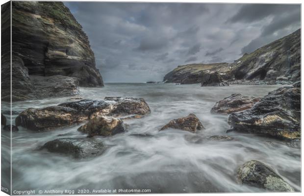 Tintagel Bay Cornwall Canvas Print by Anthony Rigg