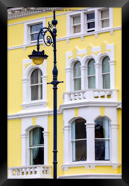 Vintage Lamp Post and Colourful Building in Llandu Framed Print by Chris Dorney