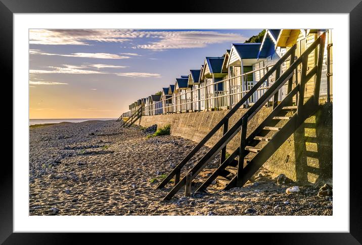Cromer beach huts at sunrise Framed Mounted Print by Chris Yaxley