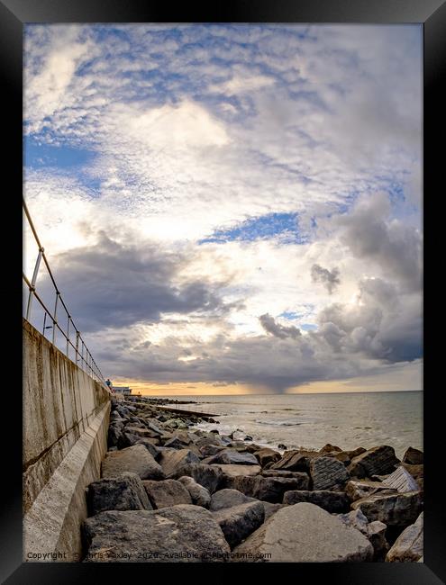 Storm clouds over the North Norfolk coast Framed Print by Chris Yaxley