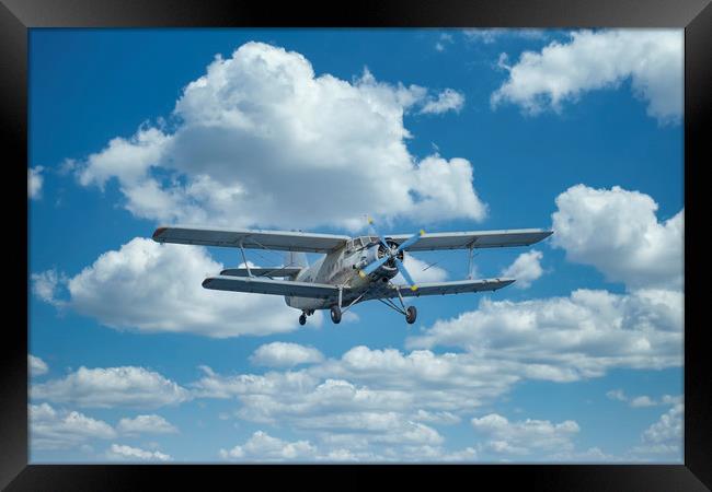 Double-winged airplane flies on a Air Show Framed Print by Arpad Radoczy