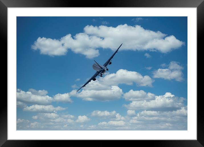 Passenger airplane on a cloudy sky Framed Mounted Print by Arpad Radoczy