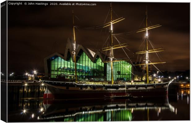 Illuminated Sailing Ship on River Clyde Canvas Print by John Hastings