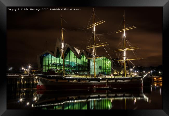 Illuminated Sailing Ship on River Clyde Framed Print by John Hastings