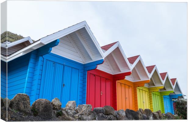 Vibrant beach huts in Scarborough Canvas Print by Jason Wells
