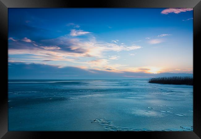 Sunrise in wintertime, lake Balaton in Hungary Framed Print by Arpad Radoczy