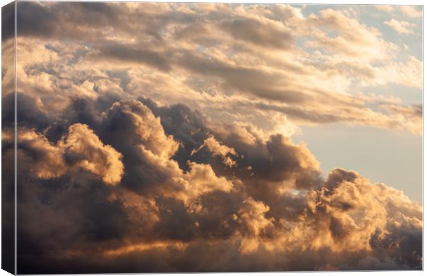 Colorful cloudy sky at sunset. Canvas Print by Arpad Radoczy