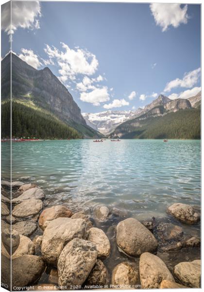 Kayakers on Lake Louise Canvas Print by Pete Evans
