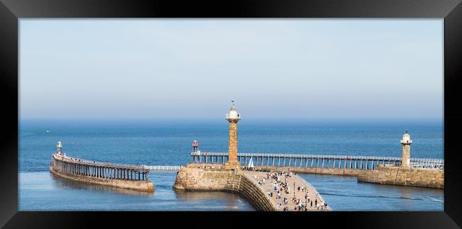 Tourists on the West pier of Whitby harbour Framed Print by Jason Wells