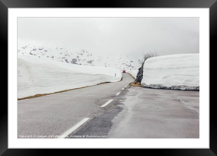 snowy road with ice Framed Mounted Print by Joaquin Corbalan