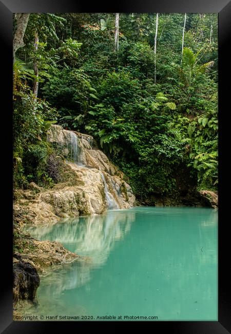 Mudal waterfall with turquoise water Framed Print by Hanif Setiawan
