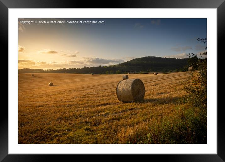 Sunset haybales Framed Mounted Print by Kevin Winter