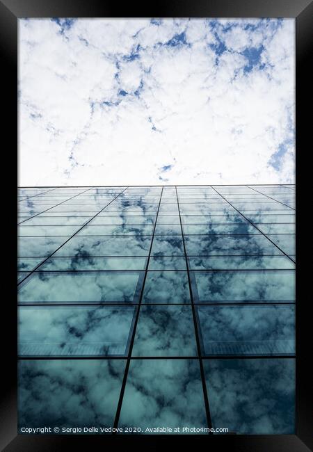 Clouds reflection Framed Print by Sergio Delle Vedove