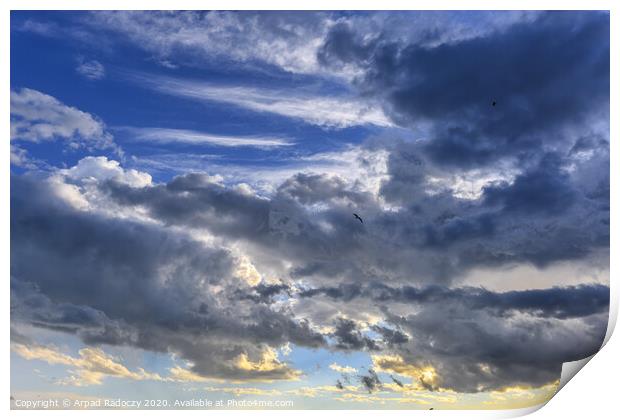 Nice clouds after a storm with sunset light Print by Arpad Radoczy