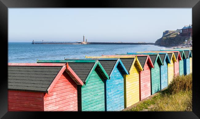 Fading beach huts at Whitby Framed Print by Jason Wells